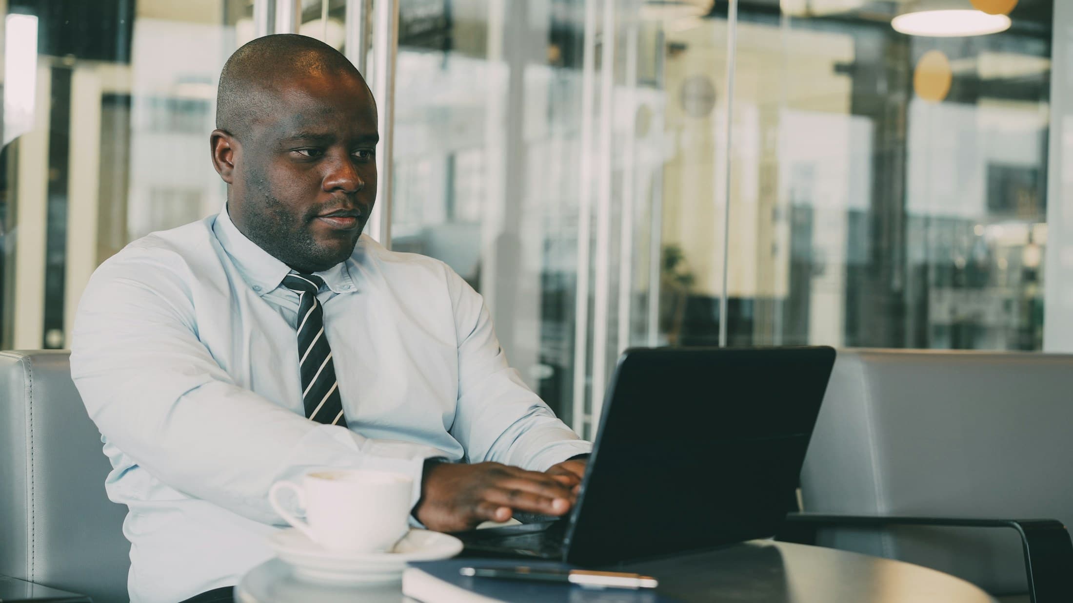 Technology professional reviewing information on a laptop