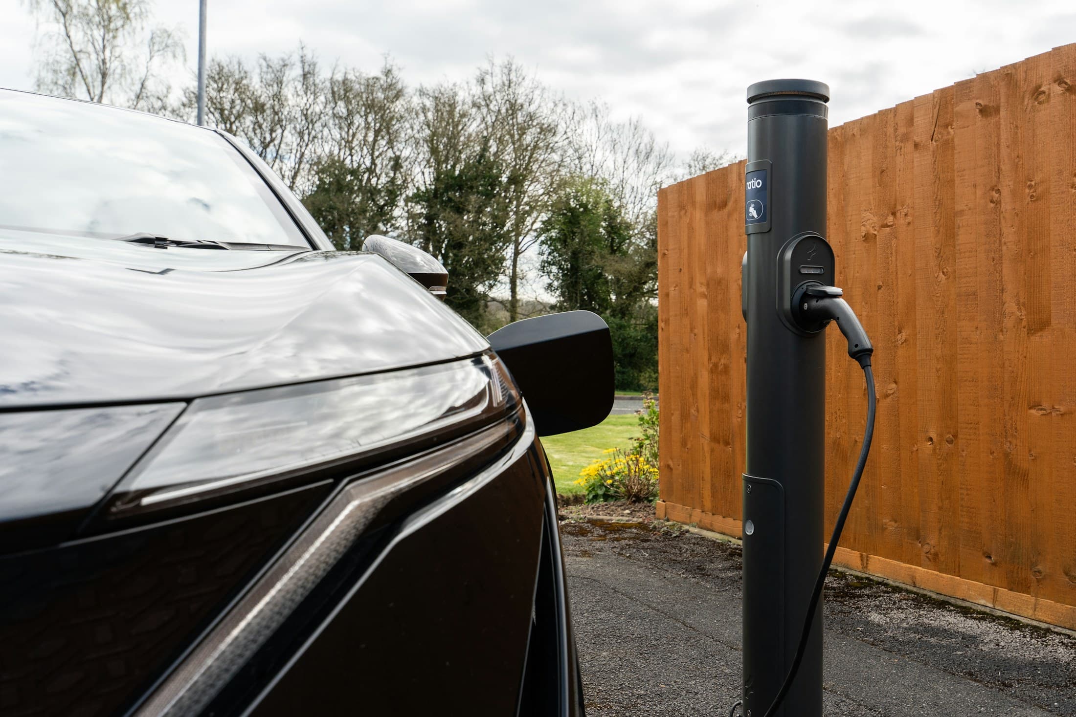 Electric vehicle connected to a modern charging point
