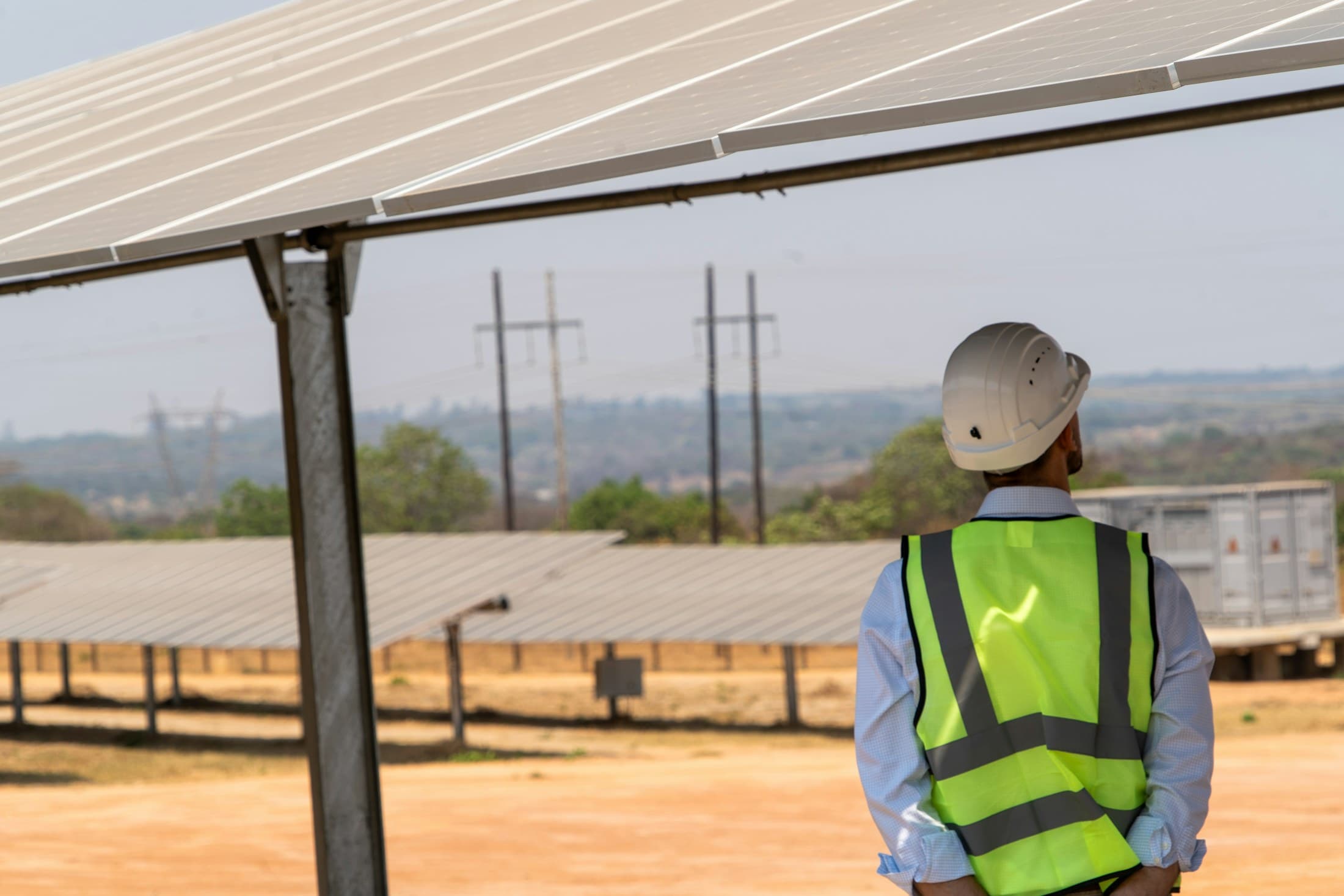 Solar engineer inspecting a utility-scale energy installation