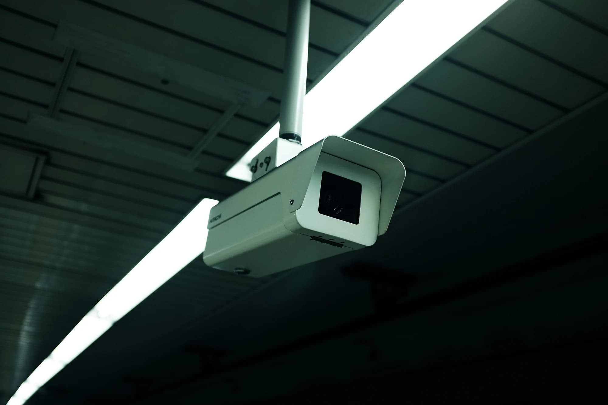Professional surveillance camera monitoring an indoor space