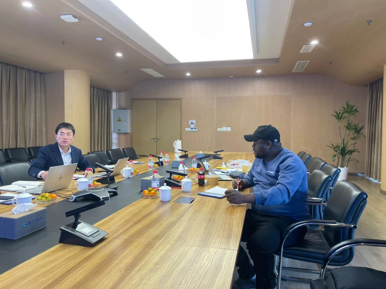 HueWave leadership in a global technology partnership meeting