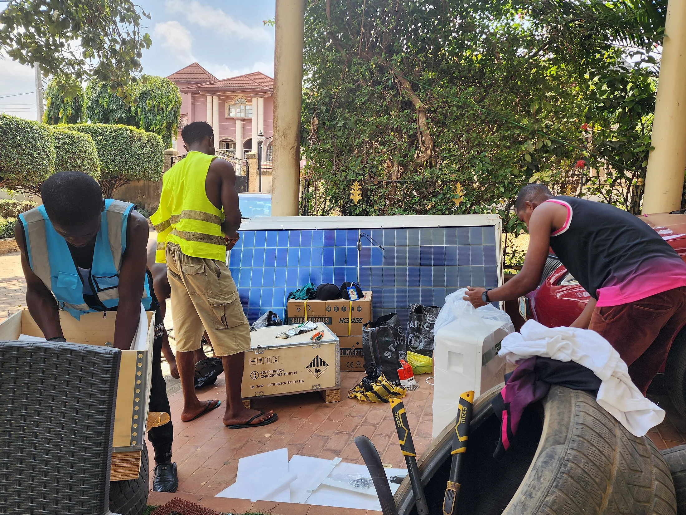 Solar technicians preparing panels and equipment for installation